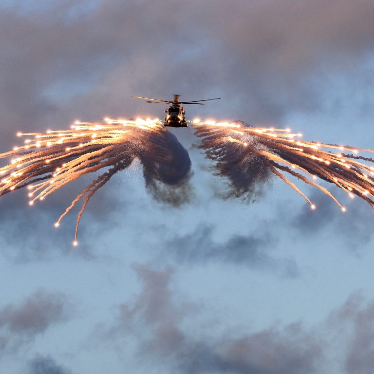 Lockheed Martin Merlin helicopter firing flares